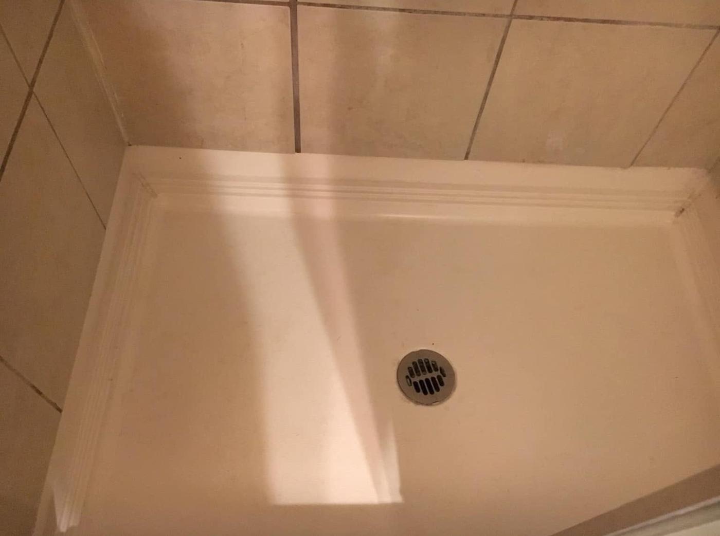 Tiled shower, after we cleaned it