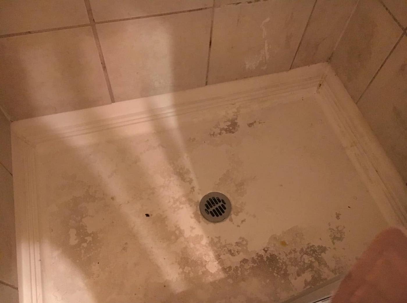 Tiled shower, before we cleaned it